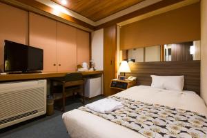 Postel nebo postele na pokoji v ubytování The Hedistar Hotel Narita