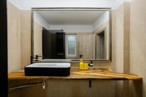 a bathroom with a sink and a mirror at MOBstar in Alba Iulia +13 photos