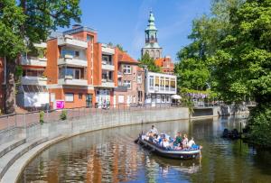 a group of people in a boat on a river at NINO-Boardinghouse 13 in Nordhorn