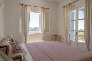A bed or beds in a room at Cozy Sea View House