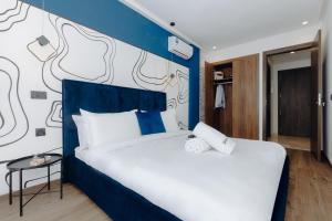 Postel nebo postele na pokoji v ubytování The Shelter Residence by GoodMove - Bourgogne, Casablanca