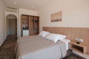 Cama ou camas em um quarto em MIKE'S STUDIOS