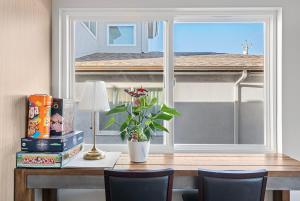 a table with a window and a plant on it at Daly city 3B Home Great location in Daly City