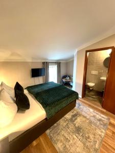 Postel nebo postele na pokoji v ubytování Hotel Garni BALTICpetite