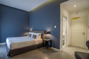 Postel nebo postele na pokoji v ubytování Boutique Hotel Metro 900