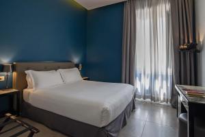 Postel nebo postele na pokoji v ubytování Boutique Hotel Metro 900