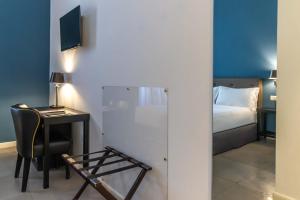 Postel nebo postele na pokoji v ubytování Boutique Hotel Metro 900