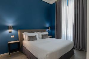 Postel nebo postele na pokoji v ubytování Boutique Hotel Metro 900