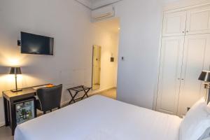 Postel nebo postele na pokoji v ubytování Boutique Hotel Metro 900