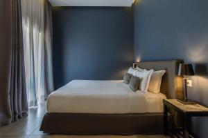 Postel nebo postele na pokoji v ubytování Boutique Hotel Metro 900
