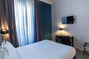 Postel nebo postele na pokoji v ubytování Boutique Hotel Metro 900