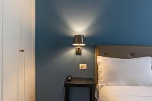 Postel nebo postele na pokoji v ubytování Boutique Hotel Metro 900