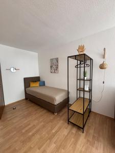 a bedroom with a bed and a book shelf at Apartment Theresa in Bad Goisern