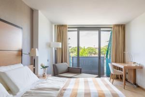 Posteľ alebo postele v izbe v ubytovaní Hotel Savoy