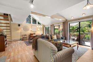 a living room with a couch and a table at Coastal Comfort Near Orleans Adventures in Orleans +31 photos