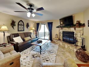 a living room with a couch and a fireplace at Innsbrook 254 in Ruidoso