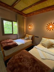 Ένα ή περισσότερα κρεβάτια σε δωμάτιο στο Agafay Toubkal View