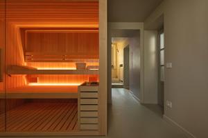 Posteľ alebo postele v izbe v ubytovaní REGO APARTMENTS - Boutique Aparthotel & Serenity Spa with some off-site apartments in the Heart of Bergamo City Center