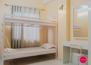 Postel nebo postele na pokoji v ubytování White Orchid