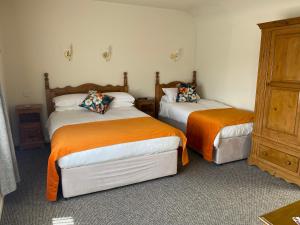Postel nebo postele na pokoji v ubytování Ros Villa Guesthouse