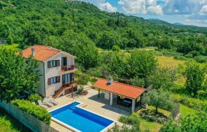 an aerial view of a house with a swimming pool at Villa Ivka-Omis by Villas Guide in Katuni