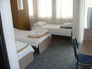 En eller flere senge i et værelse på Residence Krstanoski