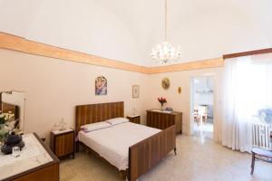 A bed or beds in a room at Casa vacanza Nonna Emma