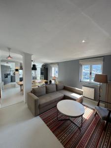 a living room with a couch and a table at La Rula in Luarca