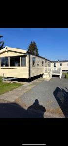 a large house with a lot of windows on it at 75 Lakeside East Haggerston Castle Park in Cheswick