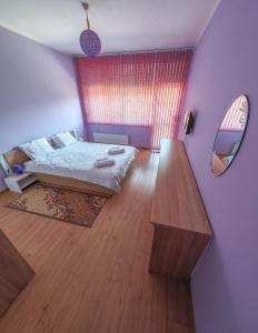 A bed or beds in a room at Apartment Petya