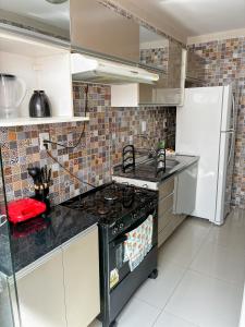 Kuchyň nebo kuchyňský kout v ubytování Apartamento Aconchegante em Paulo Afonso