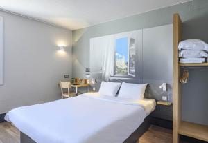 Postel nebo postele na pokoji v ubytování B&B HOTEL Orange + 37 fotografií
