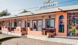 a store with a christmas tree in the window at Limanaki Apartments in Faliraki