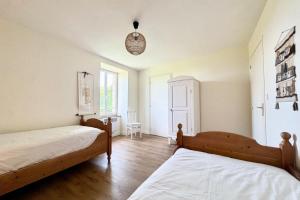 Postel nebo postele na pokoji v ubytování Maison familiale vue mer douceur à Clohars