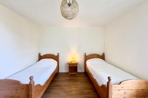 Postel nebo postele na pokoji v ubytování Maison familiale vue mer douceur à Clohars