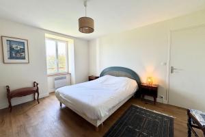 Postel nebo postele na pokoji v ubytování Maison familiale vue mer douceur à Clohars
