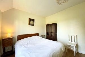 Postel nebo postele na pokoji v ubytování Maison familiale vue mer douceur à Clohars