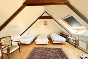 Postel nebo postele na pokoji v ubytování Maison familiale vue mer douceur à Clohars