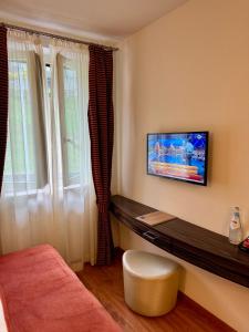 TV a/nebo společenská místnost v ubytování Esprit D'Hotel Panoramico