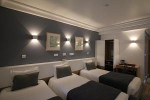 Katil atau katil-katil dalam bilik di Imperador Hotel