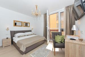 Posteľ alebo postele v izbe v ubytovaní Luka Residence Apartments