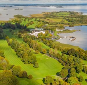 an aerial view of a golf course with a lake at Pheobes Place in Athlone