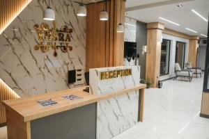 a lobby of a restaurant with a reception counter at Yusra Apart Otel in Trabzon