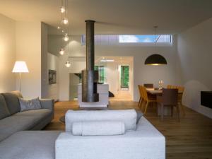 a living room with a couch and a fireplace at Edelweiss La Cerise in Flims +1 photo