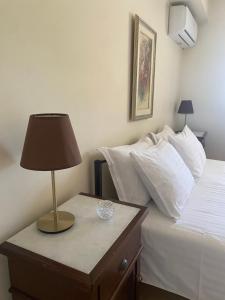 A bed or beds in a room at House with View in Amfithea