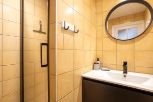 a bathroom with a sink and a mirror at La pince de crabe à 300m de la mer in Le Guilvinec +16 photos