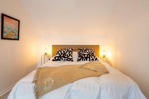 a bedroom with a bed with two pillows on it at La pince de crabe à 300m de la mer in Le Guilvinec