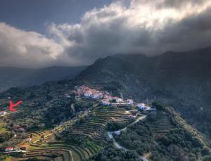 an aerial view of a village on a mountain at Manolates 360 in Manolátes