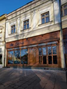 a large building with a large wooden door at Contessa Apartments in Košice