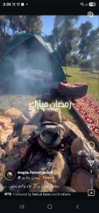 a picture of a grill with smoke coming out of it at Maple forest park cabins in Sākib